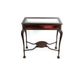 Good early 20th century mahogany bijouterie table with fine blind fret scroll carved glazed hinged