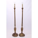 Pair of gilt gesso standard lamps, each with fluted knopped column on circular dished base,