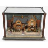 Unusual 19th century cork diorama model of a large Victorian house, in glazed case,