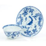 Chinese Kangxi period blue and white tea bowl and saucer - decorated with locusts and floral sprays