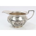 Late 19th / early 20th century Indian silver cream jug of compressed baluster form,
