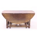 Good quality 17th century-style wake table - the elliptical hinged top on double gateleg supports