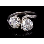 Diamond two stone ring, comprising two old cut diamonds estimated to weigh approximately 1.40 and 1.