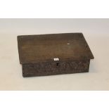 17th century carved oak bible box with hinged slope above vine scroll carved frieze,