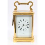 Edwardian gilt brass carriage clock with white enamel dial, retailed by Kirk & Co.