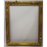 A good late 18th / early 19th century gilt and gesso frame with flower-head mounts - internal size