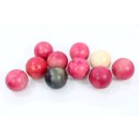 Ten antique and stained ivory snooker balls, each 5.
