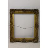 A 19th century gilt and gesso frame - internal size 77cm x 64cm