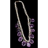 Victorian amethyst and seed pearl necklace with eleven graduated oval cut amethysts suspended from
