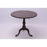 George III mahogany supper table, the well-figured solid tilt-top of petalled circular outline,