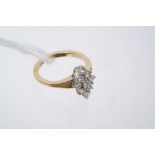 Diamond cluster ring with a marquise-shape cluster of nine brilliant cut diamonds estimated to