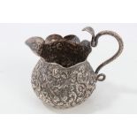Late 19th / early 20th century Indian Kutch silver cream jug of baluster form,