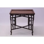 Antique Chinese hardwood tray on stand, the rectangular tray with geometric scroll and ball frieze,