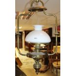Antique Swedish brass ships' lantern, the oil lamp with opaline glass shade pivoting on a gimbal,