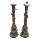 Pair late 19th / early 20th century Japanese bronze table lamps with dragon and mask decoration,