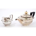 19th century Dutch silver teapot of half-fluted form, with cast shell and gadrooned borders,