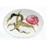 A Chelsea oval dish, unusually painted in coloured enamels with a purple tulip and scrolling leaves,