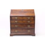 George III flame mahogany bureau - the fall enclosing fitted interior about blind fret cupboard,