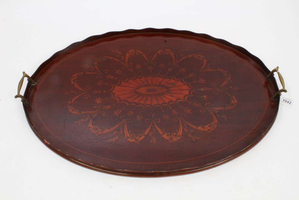 Edwardian inlaid mahogany Sheraton revival oval tray with floral swag decoration and brass handles,