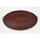 Edwardian inlaid mahogany Sheraton revival oval tray with floral swag decoration and brass handles,