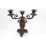 Regency-style bronze three-branch candelabrum with leaf, scroll and swan decoration,