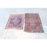 Persian rug - navy ground with stepped central medallion and figural ornament within architectural