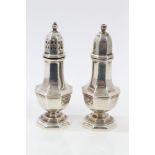 Pair contemporary silver salt and pepper condiments of hexagonal baluster form, with slip-in covers,