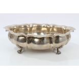 Italian silver dish of oval lobed form, with flared border and spot-hammered finish,