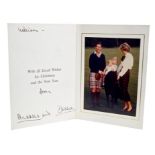 TRH The Prince and Princess of Wales - signed Christmas card with twin gilt embossed Royal ciphers