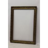 A late 19th century gilt and gesso frame - internal size 92cm x 61cm