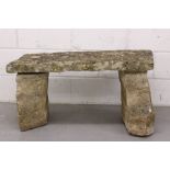 Carved stone bench, slab top on stone supports,