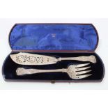 Pair Victorian silver Kings pattern fish servers with pierced and engraved floral decoration,