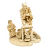 Fine late 19th century Japanese carved ivory okimono in the form of a farmer and child,