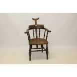 Unusual 19th century beech and elm captains chair of typical bow form, with adjustable headrest,