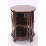 Unusual Edwardian mahogany revolving bookcase of cylindrical form, with slatted divisions,