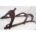 Unusual antique camel saddle of curved wooden form,