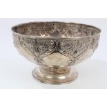 Edwardian silver rose bowl of circular form, with embossed foliate and floral decoration,