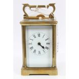 Early 20th century brass carriage clock with white enamel dial,