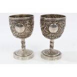Pair late 19th / early 20th century Chinese silver egg cups with bamboo and bird decoration,