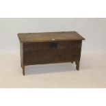 Late 17th century oak six-plank coffer, the moulded top hinging on pins with arcaded carved frieze,