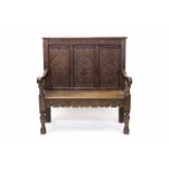 19th century carved oak settle with triple geometric relief carved panel back and solid seat