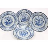 Four 18th century Chinese export blue and white plates with vase of flowers and floral decoration,