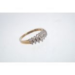 Diamond cluster ring with two rows of brilliant cut diamonds in tiered claw setting,