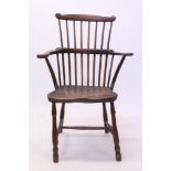 Good early 19th century beech and elm primitive comb back elbow chair with bowed stick back and