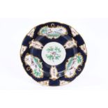 18th century Worcester plate with polychrome painted exotic bird and insect reserves within gilt