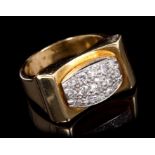 1940s / 1950s diamond dress ring of Odeonesque design, with a pavé set diamond bombe plaque,