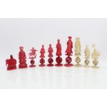 Ten 19th century Chinese carved and red stained ivory chess pieces - each finely carved figure on