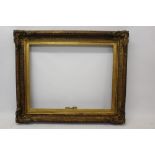 A mid-19th century gilt and gesso frame - internal size 92cm x 72cm CONDITION REPORT