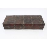 Antique African leather bound and iron mounted box, ring hinges and flanking carrying handles,