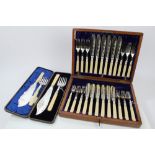 Set of twelve pairs silver plated fish eaters with ivorine handles, in a fitted case,